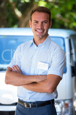 Handyman standing near his delivery van