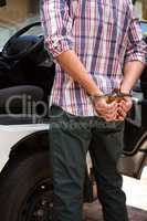 Man handcuffed behind his back