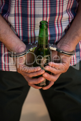 Man handcuffed behind his back