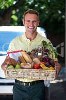 Happy man delivering groceries