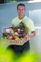 Happy man delivering groceries