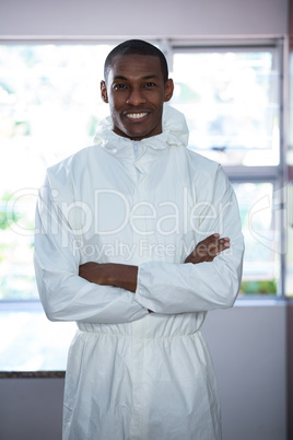 Portrait of pest control man standing with arms crossed