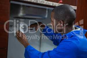 Plumber repairing a sink