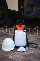 Insecticide sprayer on pavement
