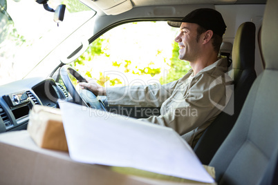Delivery man driving his van