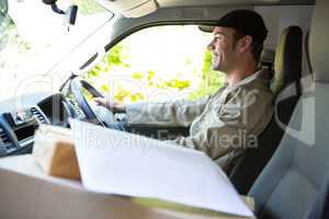 Delivery man driving his van