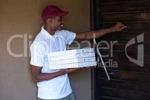 Pizza delivery man with pizzas boxes