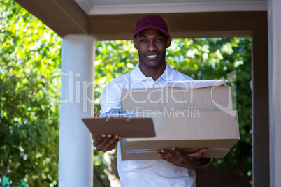 Happy delivery man with parcel