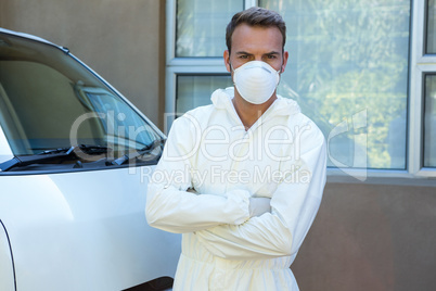 Portrait of pest control man standing next to a van