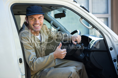 Delivery man sitting in his van