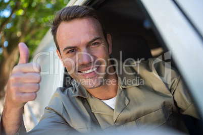 Delivery man sitting in his van