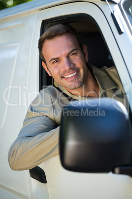 Delivery man driving in his van