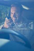 Delivery driver talking on walkie-talkie