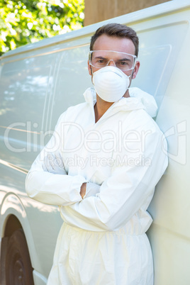 Portrait of pest control man standing next to a van