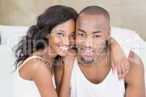 Portrait of young couple in the bedroom