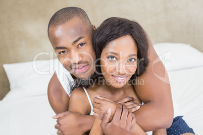 Portrait of young couple in the bedroom