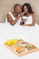 Young couple having breakfast