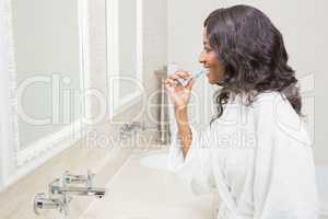 Young woman brushing her teeth