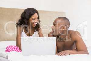 Young couple using a laptop