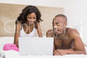 Young couple using a laptop