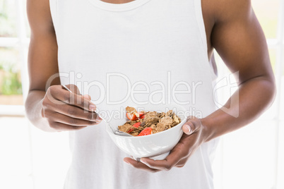 Close-up of man having breakfast cereals