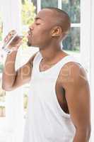 Young man drinking water