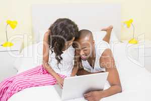 Young couple using a laptop