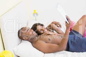 Young couple using a digital tablet