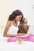 Young couple using a laptop