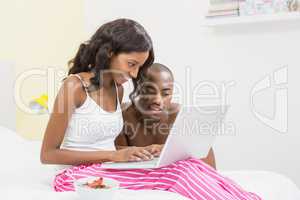 Young couple using a laptop