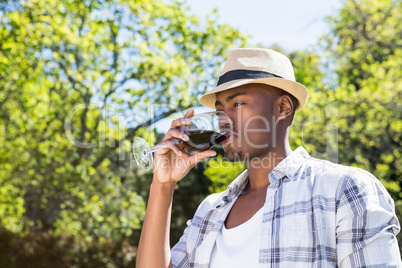 Young man drinking wine