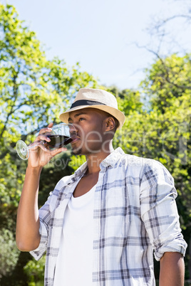 Young man drinking wine