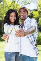 Young couple toasting glasses of champagne