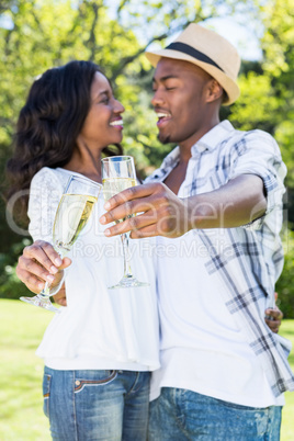 Young couple toasting glasses of champagne