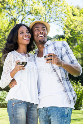 Young couple toasting glasses of wine