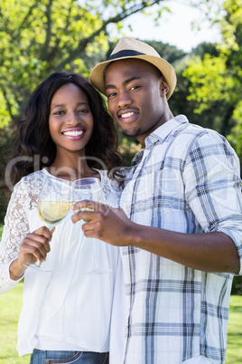 Young couple toasting glasses of wine