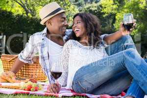 Young couple having a picnic in the park