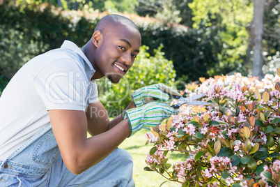 Young man cutting flowers