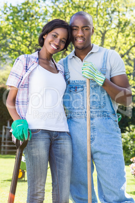 Young couple posing in their garden