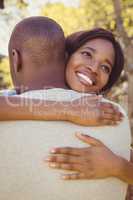 Young couple hugging in park