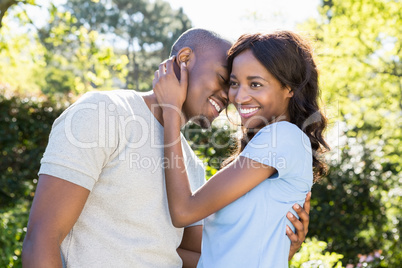 Couple embracing in the park