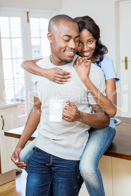 Young couple holding coffee mug Young couple holding coffee mug