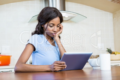 Young woman using digital tablet