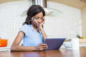 Young woman using digital tablet