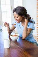 Young woman having breakfast