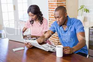 Young woman using laptop in the kitchen