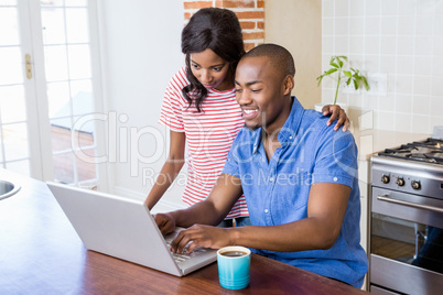 Young couple using laptop