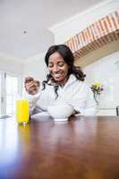 Young woman having breakfast