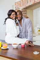 Young couple cuddling in the kitchen