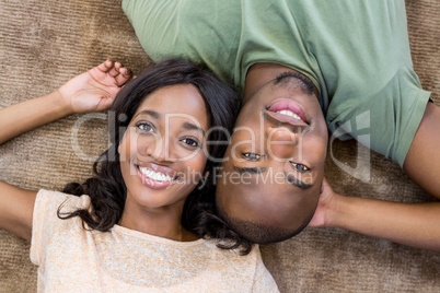 Young couple at home relaxing on the floor